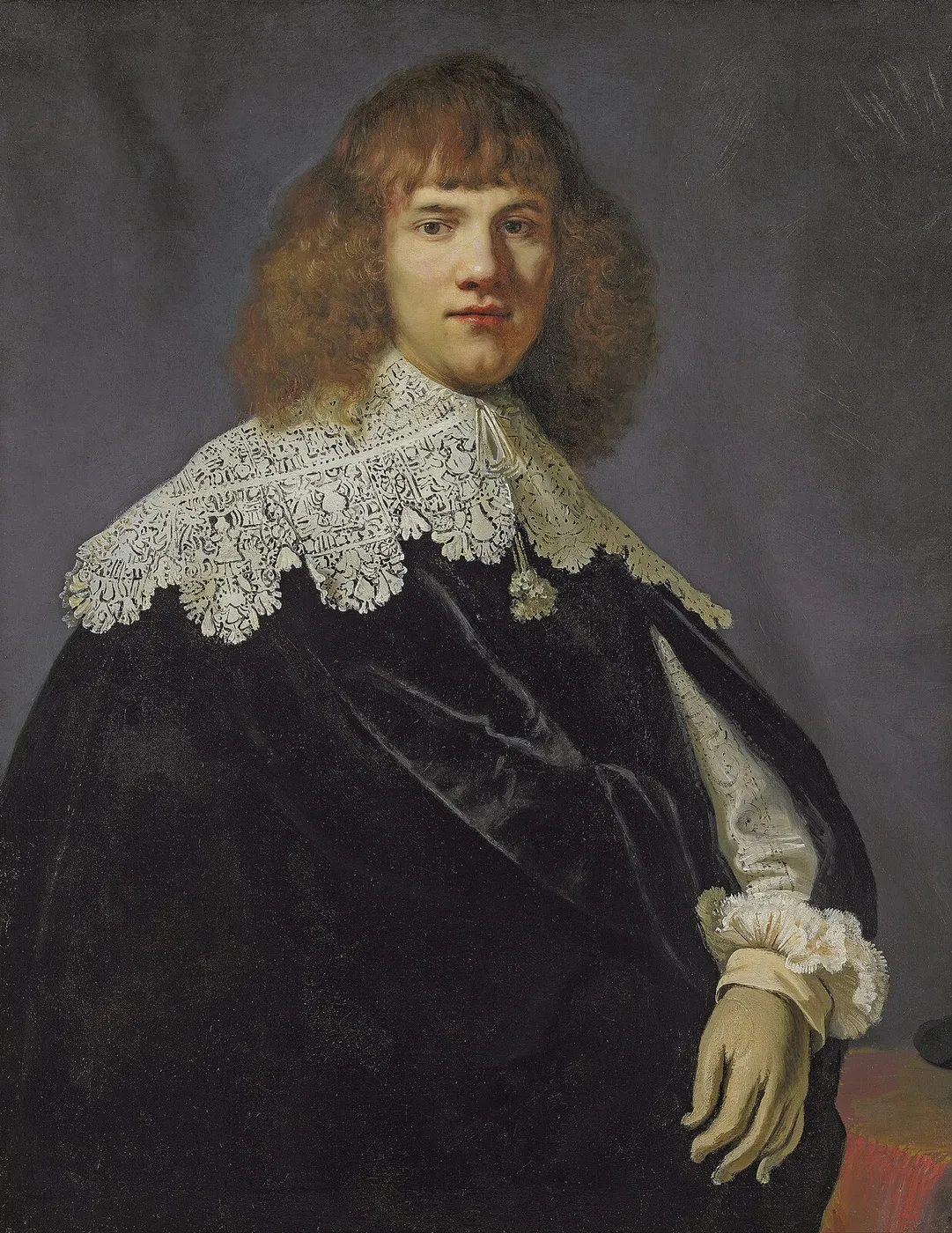 Portrait of a gentleman, half-length, in a black velvet cloak and white lace collar and cuffs — Rembrandt